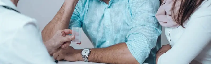 Doctor with man and women together