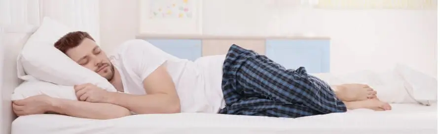 Man sleeping on two pillows